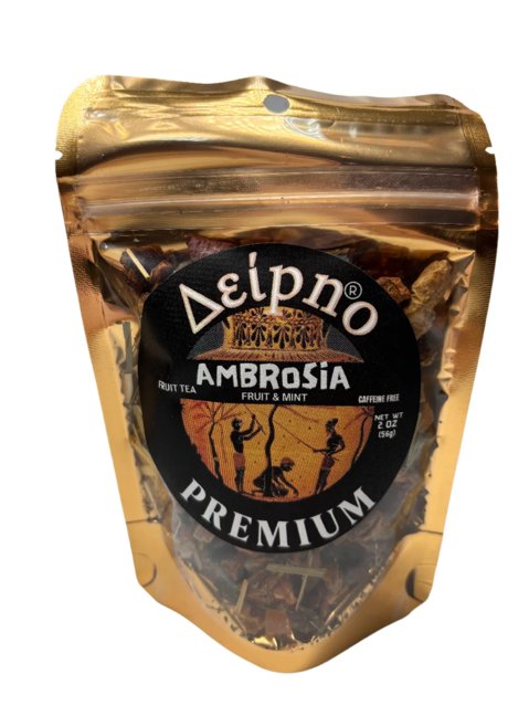 Ambrosia fruit tea blend with apple, papaya, guava, and mint in a glass cup.