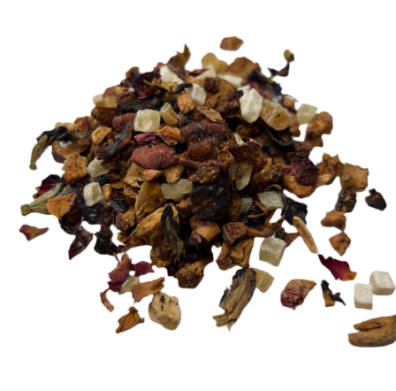 A loose pile of dried fruit tea blend with colorful pieces of apple, hibiscus, and small sugar cubes on a white background.