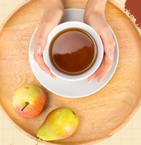 a tea cup with fruits on a plate.