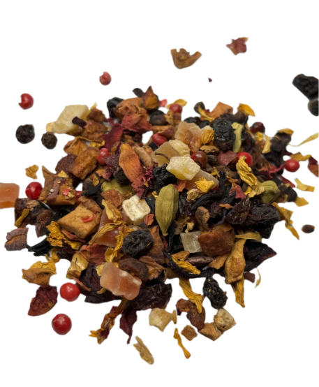 Colorful loose leaf fruit tea blend with berries, cardamom, and dried petals, showing a vibrant mix of natural ingredients.