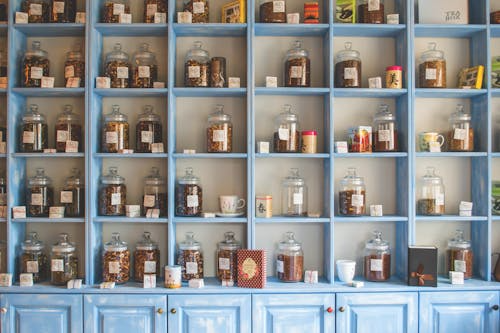 Organized pantry with assorted teas and gourmet spices.